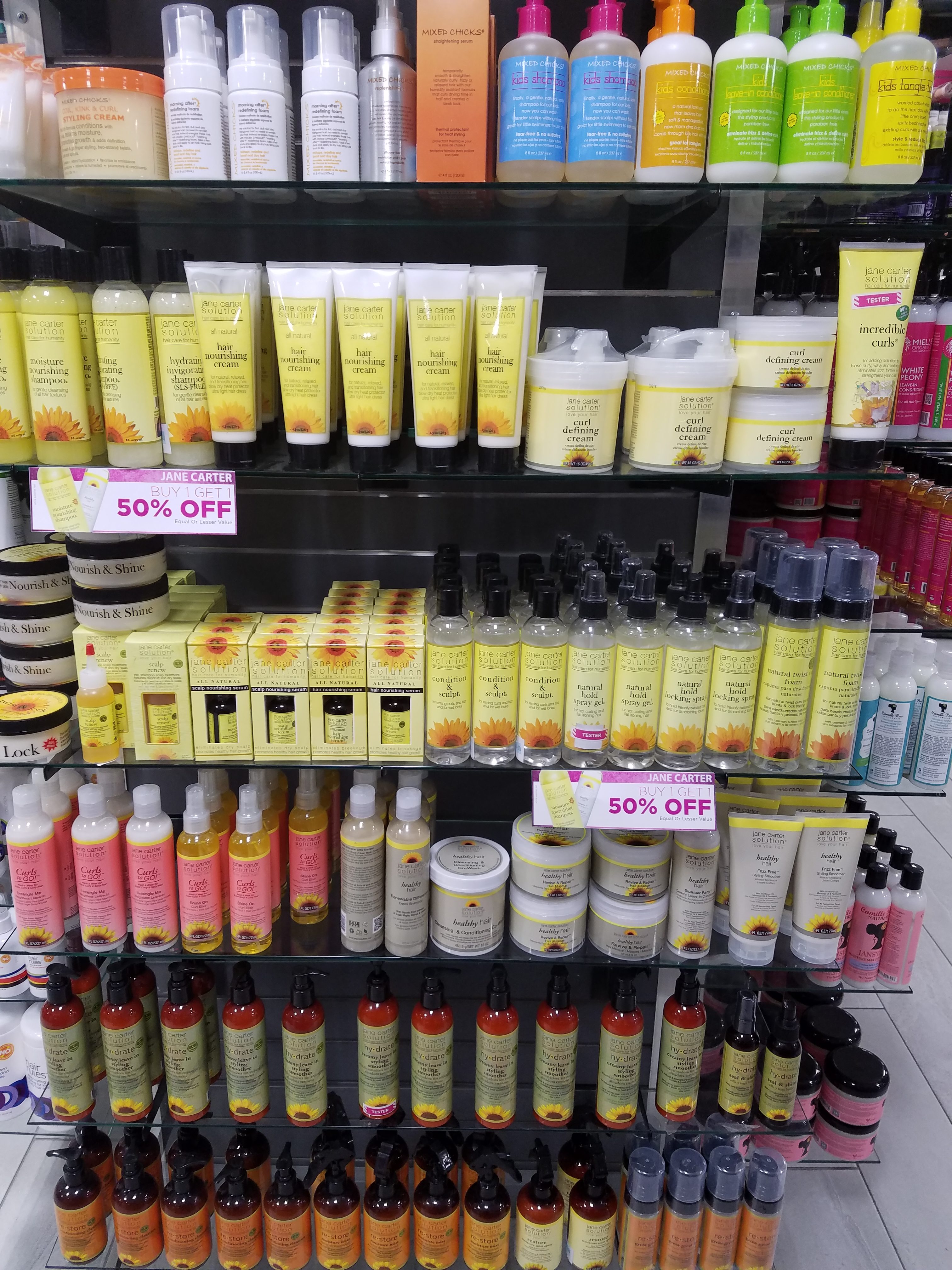 bottles of natural hair products on shelves